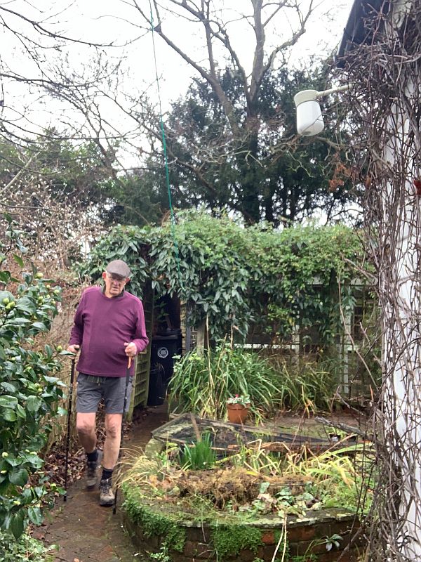 Bobby with his walking poles in the garden at Laurel Cottage as he does his 43 steps.