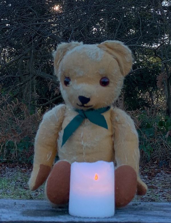 Eamonn on the Bench, with a candle lit for Diddley.