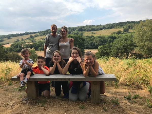 Big Jay, Jasmine, Little Jay, Sonny, Faith, Layla, Kyla posing at The Bench