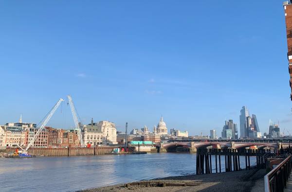 An ordinary picture of the Thames looking east. Made extraordinary by the cranes and turquoise buildings. Revealing the site of a giant hole leading down to the creation of London's Super Sewer, currently under construction.