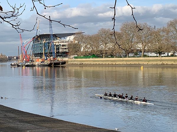 New Riverside Stand. Lots of rowing clubs along the south bank. Many from posh schools. This rowing eight all schoolchildren.
