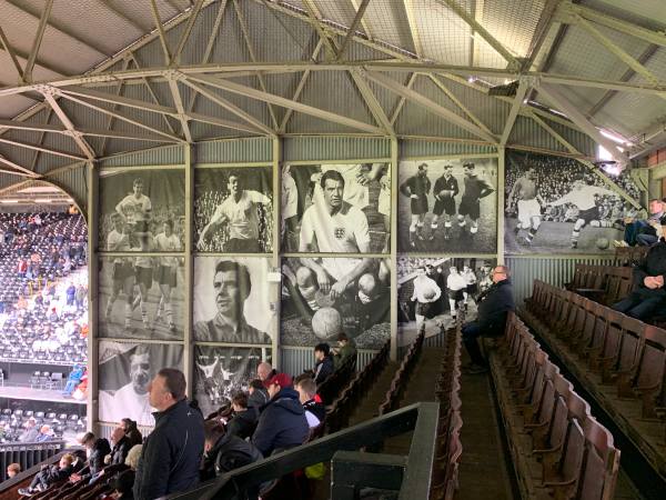 Pictures of Johnny Haynes on the end wall of the stand.