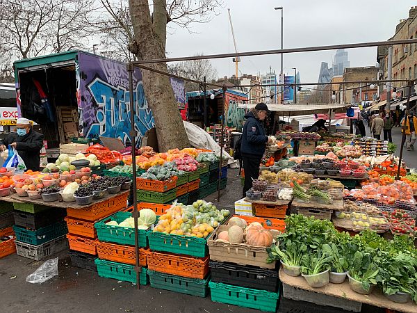 78 Plus One. Colourful fruit and veg stall in Whitechapel Market on Bobby's walk.