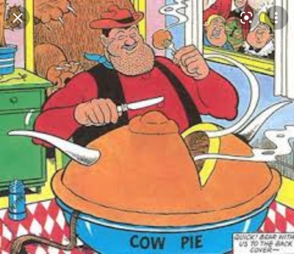 Desperate Dan eating his signature "cow pie".