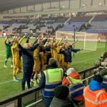 Sutton United Football Team celebrating to the crowd as the Follow that Dream.