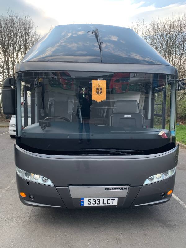 Front of The Supporters' Coach, Neoplan S33 LCT. Spot the coffee cup! Bobby is reflected in the windscreenas he takes the photo.