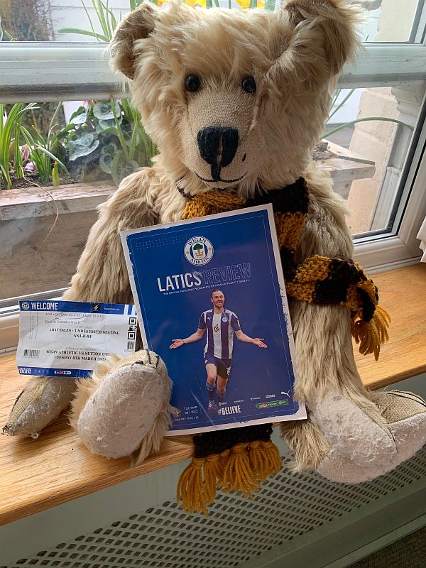 Bertie with Bobby's programme and ticket for the Wigan Athletic match.