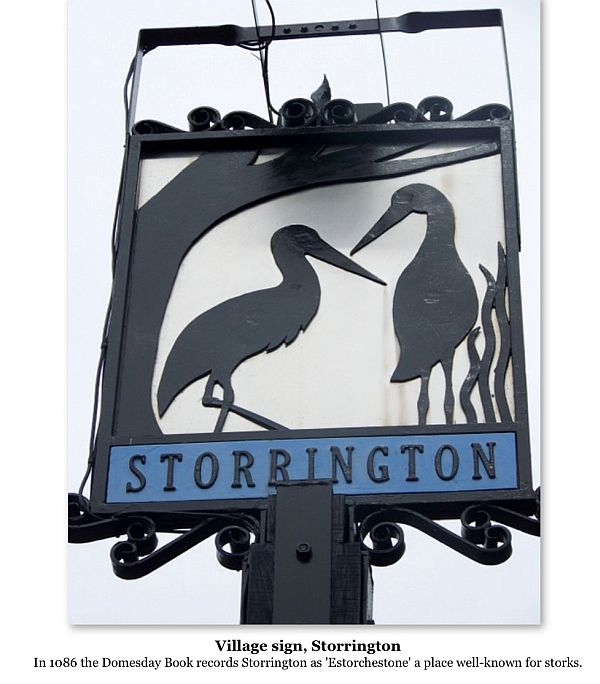 Storrington village sign, featuring a pair of Storks in silhouette.