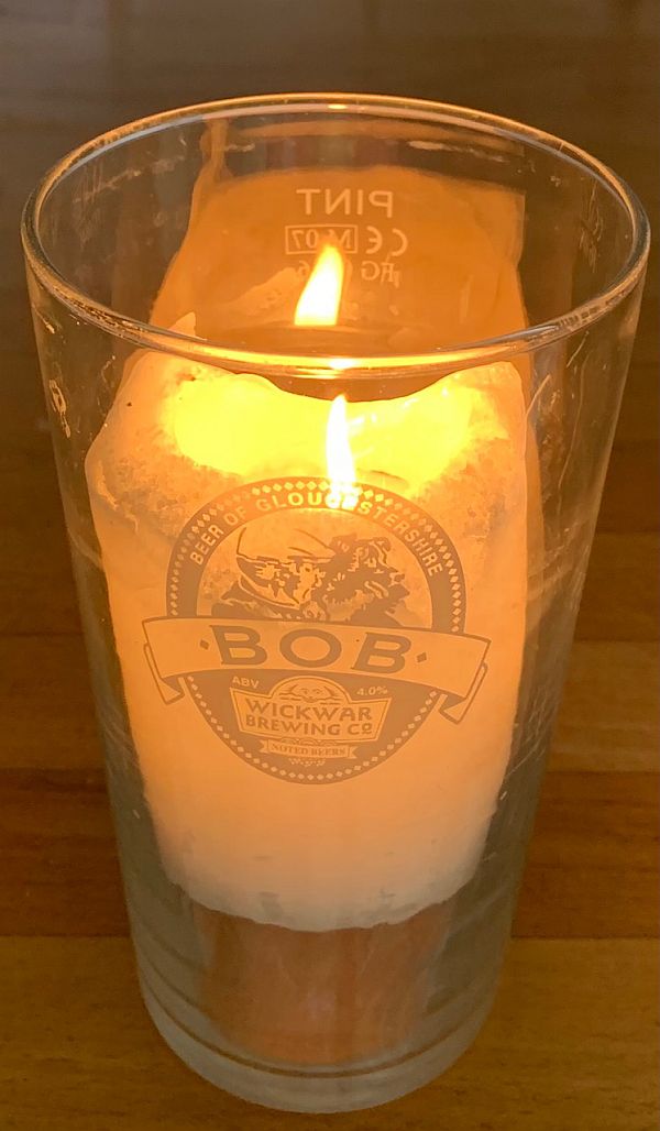 A Candle lit for Diddley and Anne in a Bob Beerglass Wickwar Brewing Company.