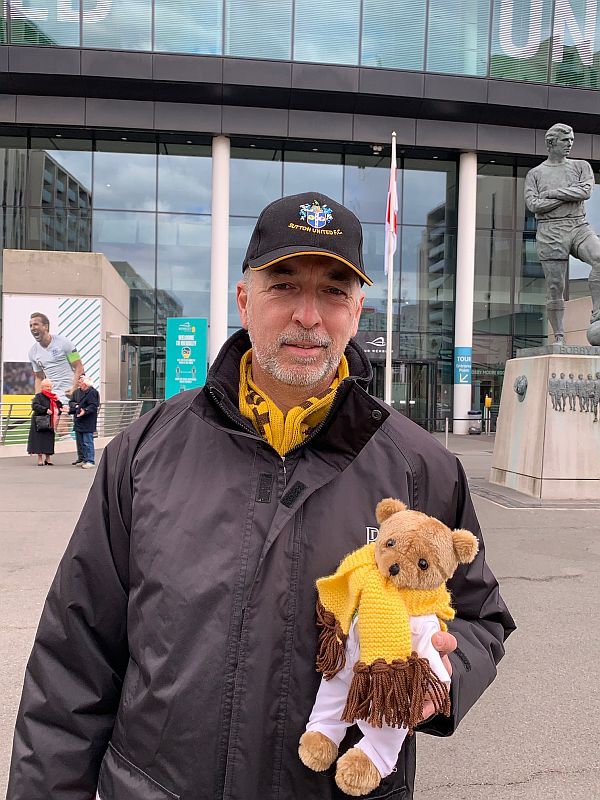 Andrew, holding Brooklands Bertie, in front of the Bobby Moore statue.