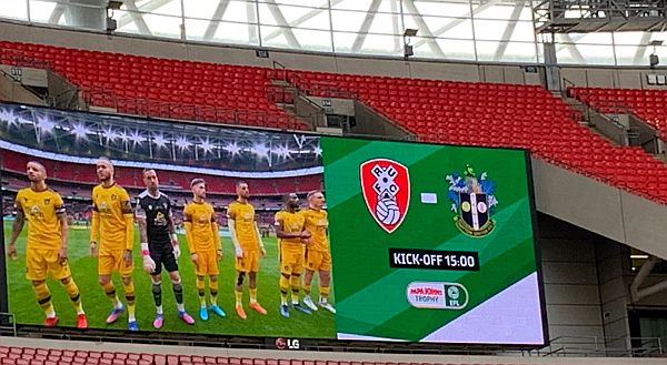 The Sutton United players lined up on the big screen.