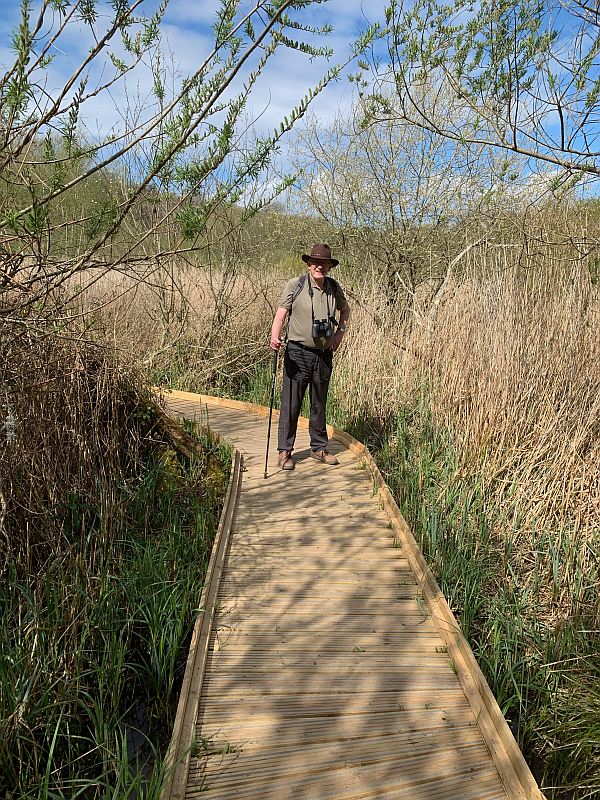 Bobby dressed like an explorer on a boardwalk at the Wildlife and Wetlands Trust, Arundel.
