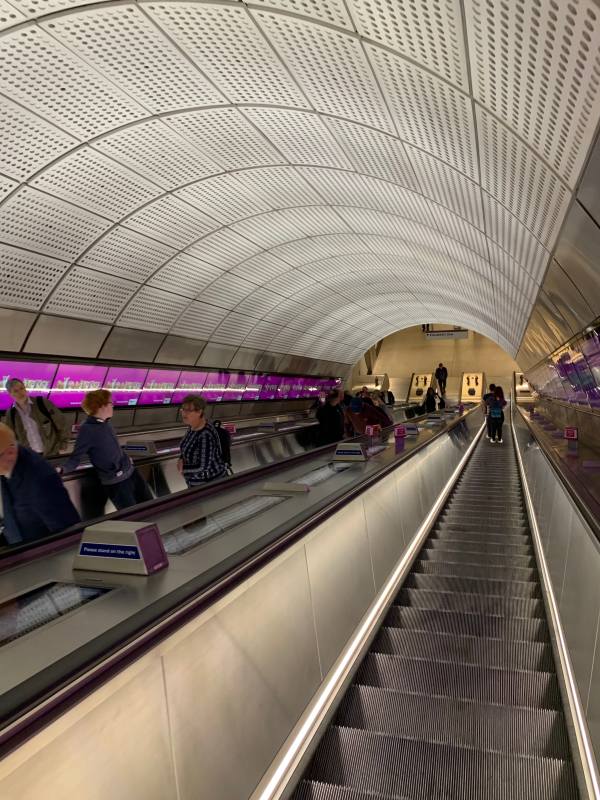 Descending an escalator to the Elizabeth Line at Farringdon.