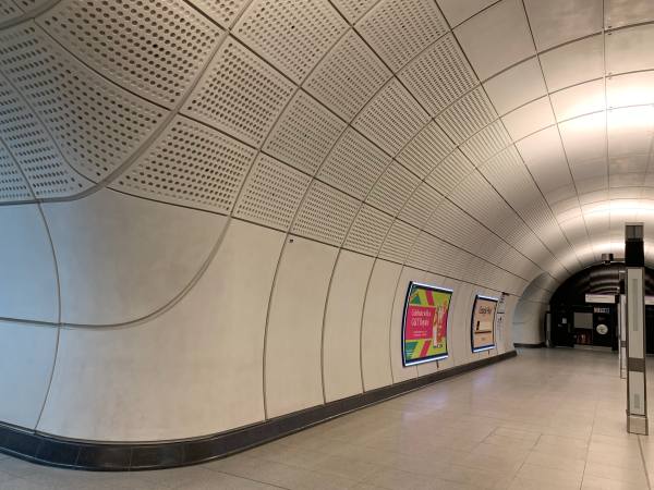 Elizabeth Line passenger tunnels. Plain, but bright, spacious and airy.