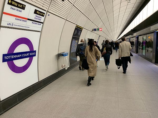 Platform on the Elizabeth Line at Tottenham Court Road, with the trains separated off by a glass barrier with sliding doors.