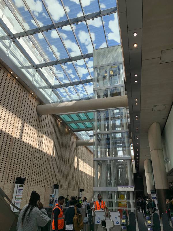 Lifts to the Elizabeth Line glass-roofed concourse at Paddington.