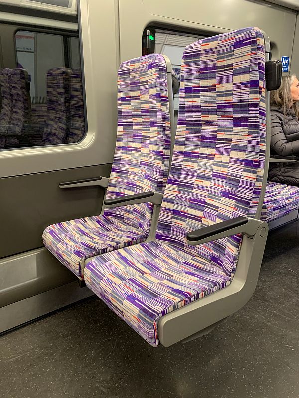 A pair of bay seats on an Elizabeth Line train.