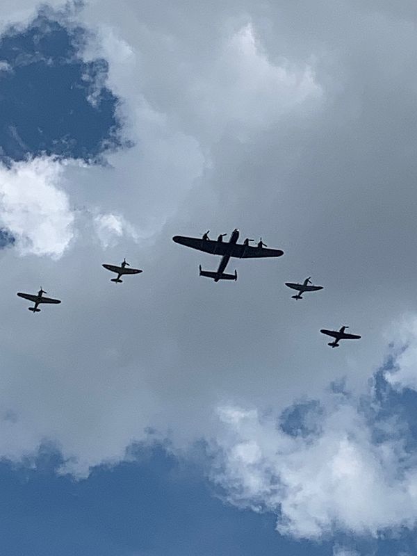 Battle of Britain Memorial Flight. Lancaster, two Spitfires, two Hurricanes over Belgravia Square.