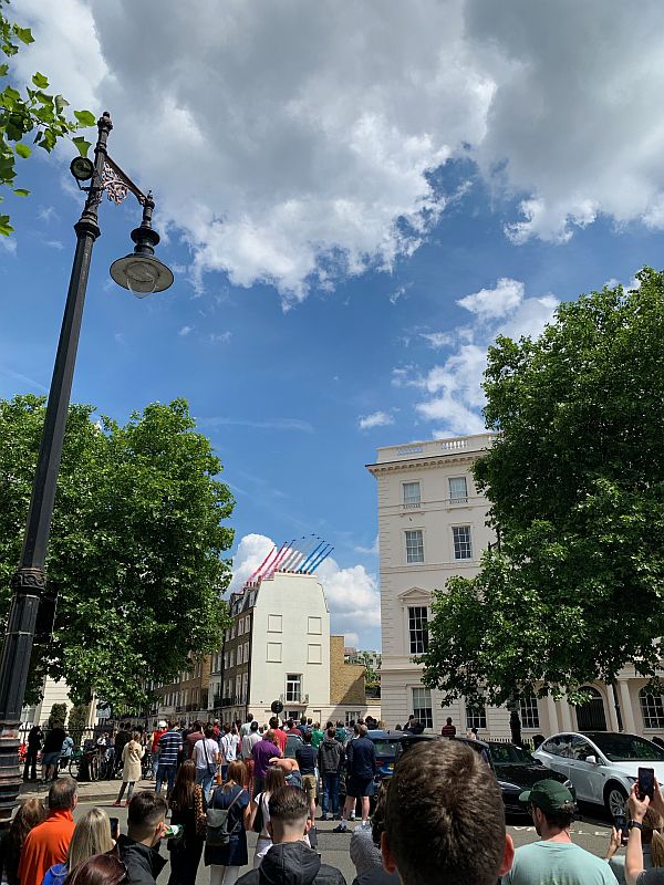 The Red Arrows in the distance over Belgravia Square.