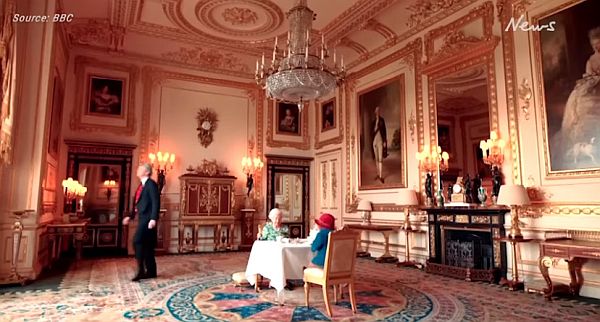 The Queen having tea with Paddington Bear.