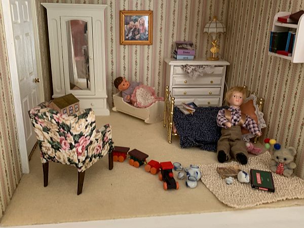 "Pippin playing in the spare room. Hand made chair and photo of real life grandchildren.