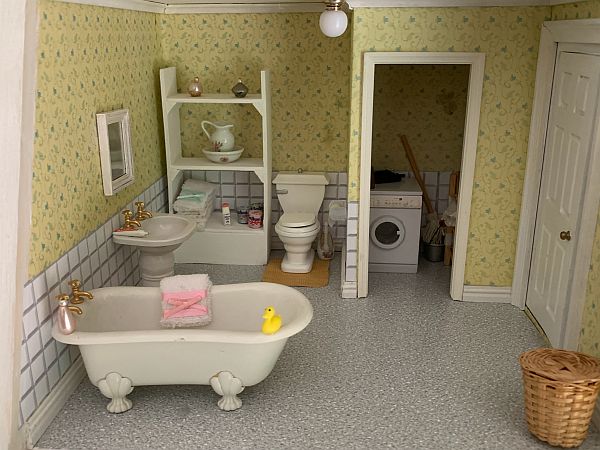Gill: "Bathroom and utility. Grandma is hoping that Grandpa will fit a shower in here soon. The bathroom would not be complete without a yellow duck."