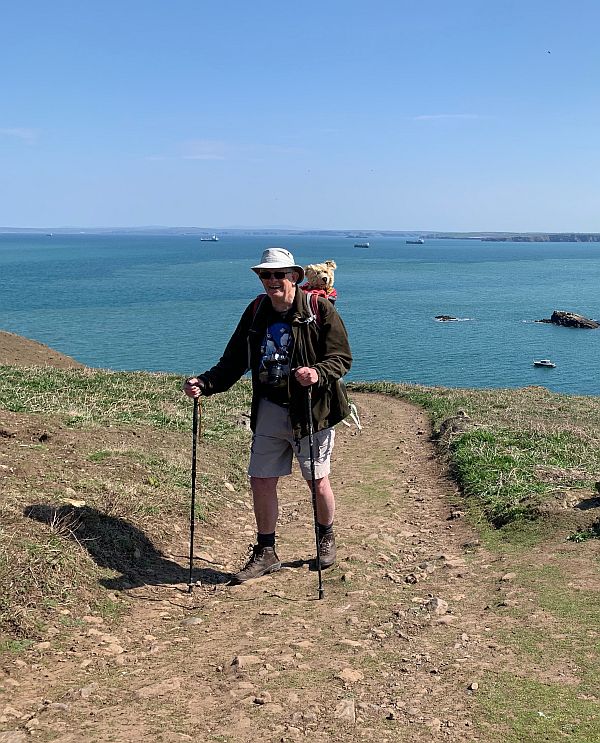 Bobby on Skomer with his walking poles and Bertie in the rucksack on his back.