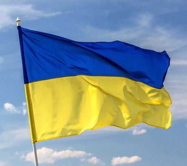 The blue and yellow national flag of Ukraine.