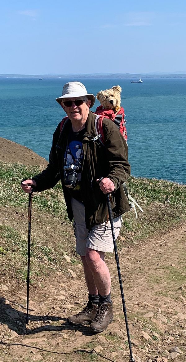 Bobby, with Bertie in his rucksack, walking with his pacer poles on Skomer Island.