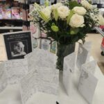 Floral tributes and messages of condolence in Morrison's, Brentford.