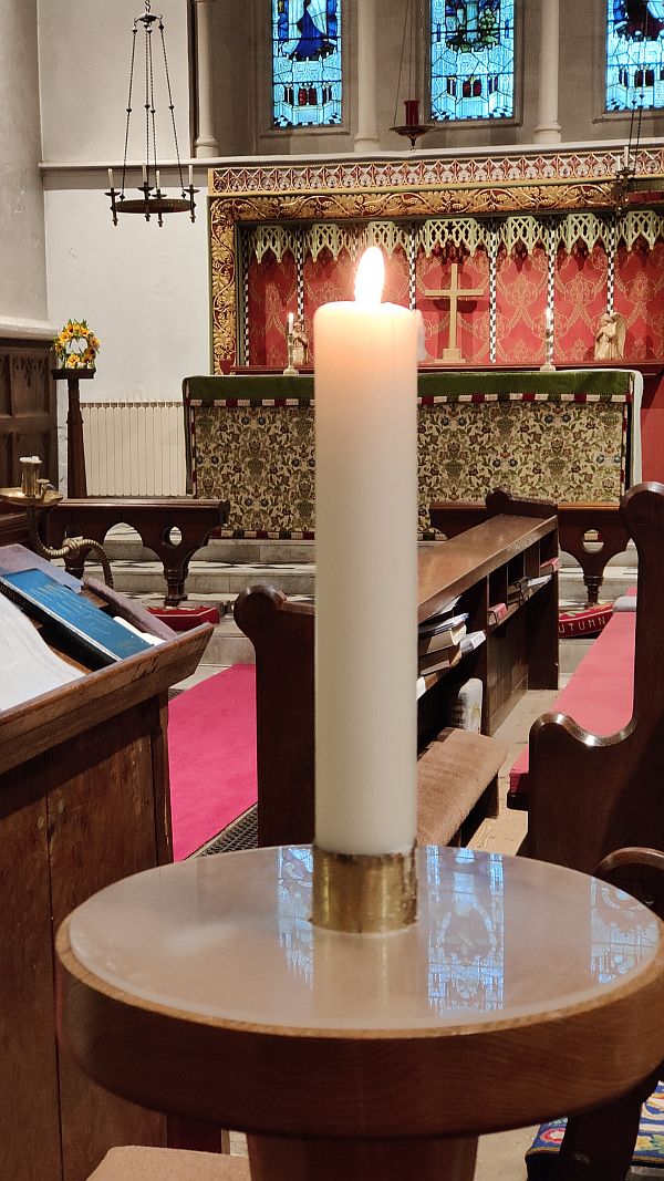 The candle lit in the church for Bobby and Diddley.