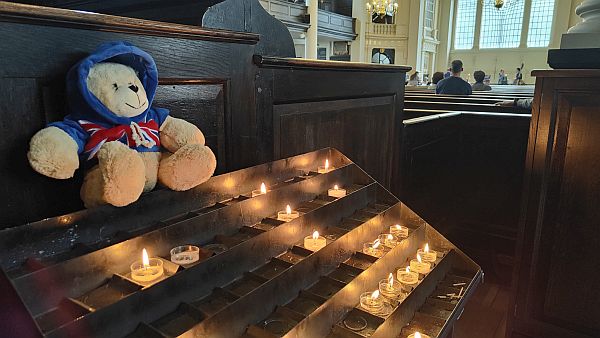 Charlie, with a candle lit for Bobby and Diddley in St Martin-in-the-Fields.